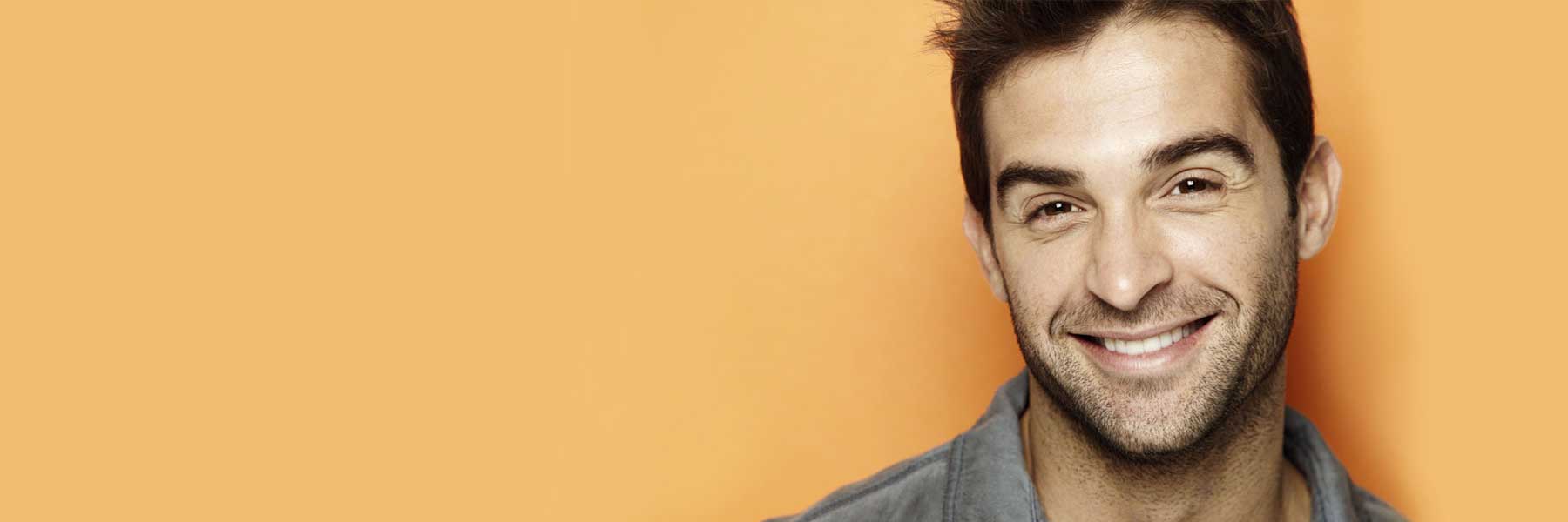 Patients smiling with new tooth colored fillings